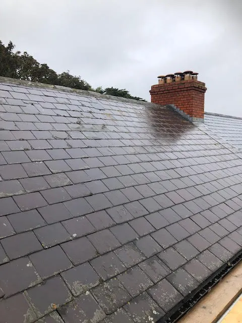 Roof being replaced. Existing Bangor slates on the front and side slopes. New Spanish slates on the back — photo 2