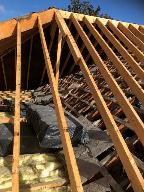 Roof being replaced. Existing Bangor slates on the front and side slopes. New Spanish slates on the back — photo 4