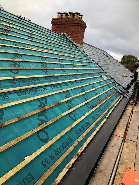 Roof being replaced. Existing Bangor slates on the front and side slopes. New Spanish slates on the back — photo 5