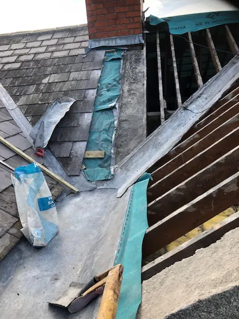 Roof being replaced. Existing Bangor slates on the front and side slopes. New Spanish slates on the back — photo 7