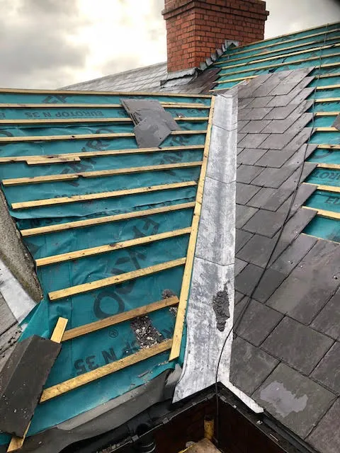 Roof being replaced. Existing Bangor slates on the front and side slopes. New Spanish slates on the back — photo 11