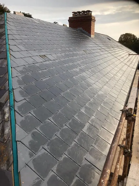 Roof being replaced. Existing Bangor slates on the front and side slopes. New Spanish slates on the back — photo 16