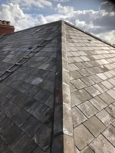 Roof being replaced. Existing Bangor slates on the front and side slopes. New Spanish slates on the back — photo 20